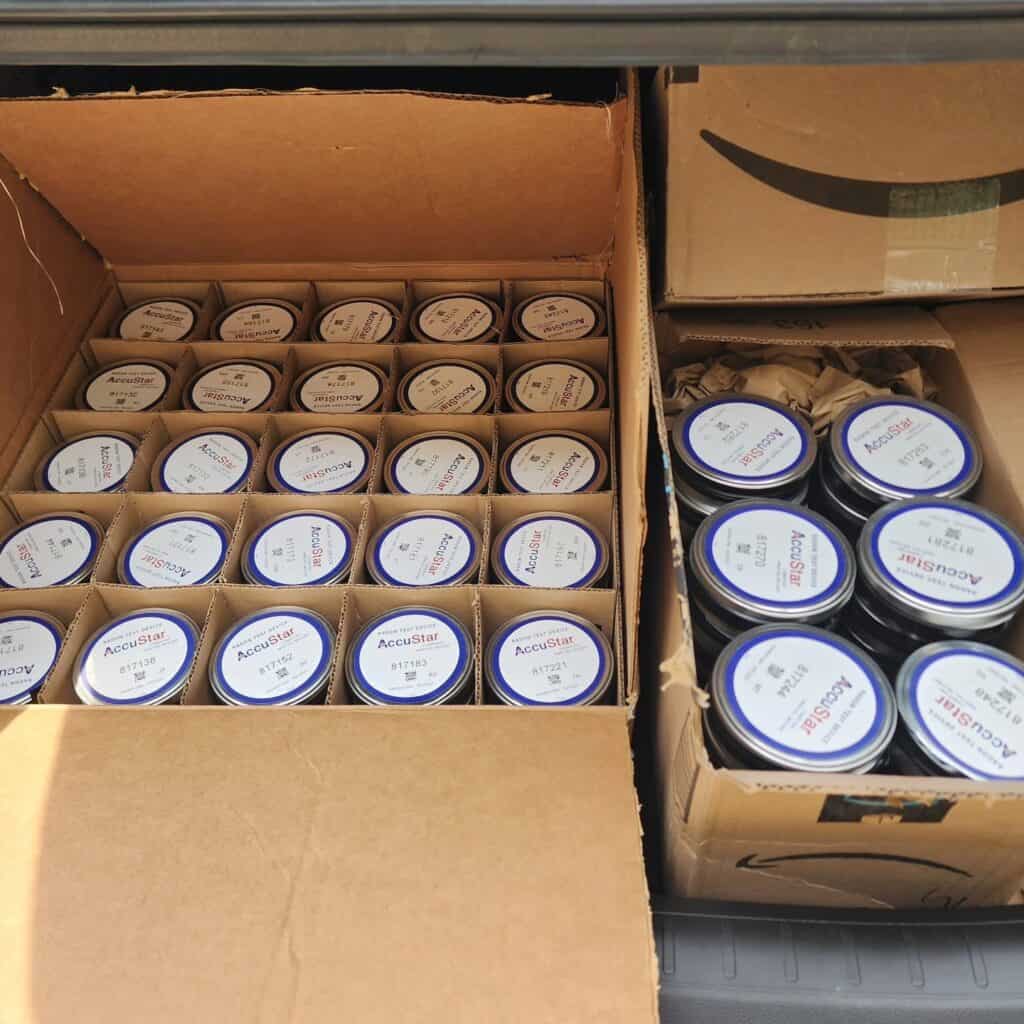 Boxes of inspection supplies and tools for property assessment.